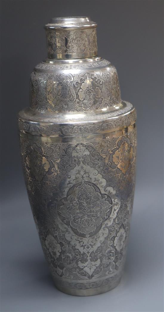 A Persian engraved white metal cocktail shaker, 561 grams.